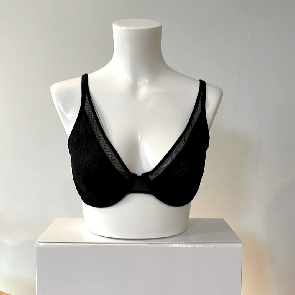 Black lace unlined bra. Features rear clasp for racerback style.